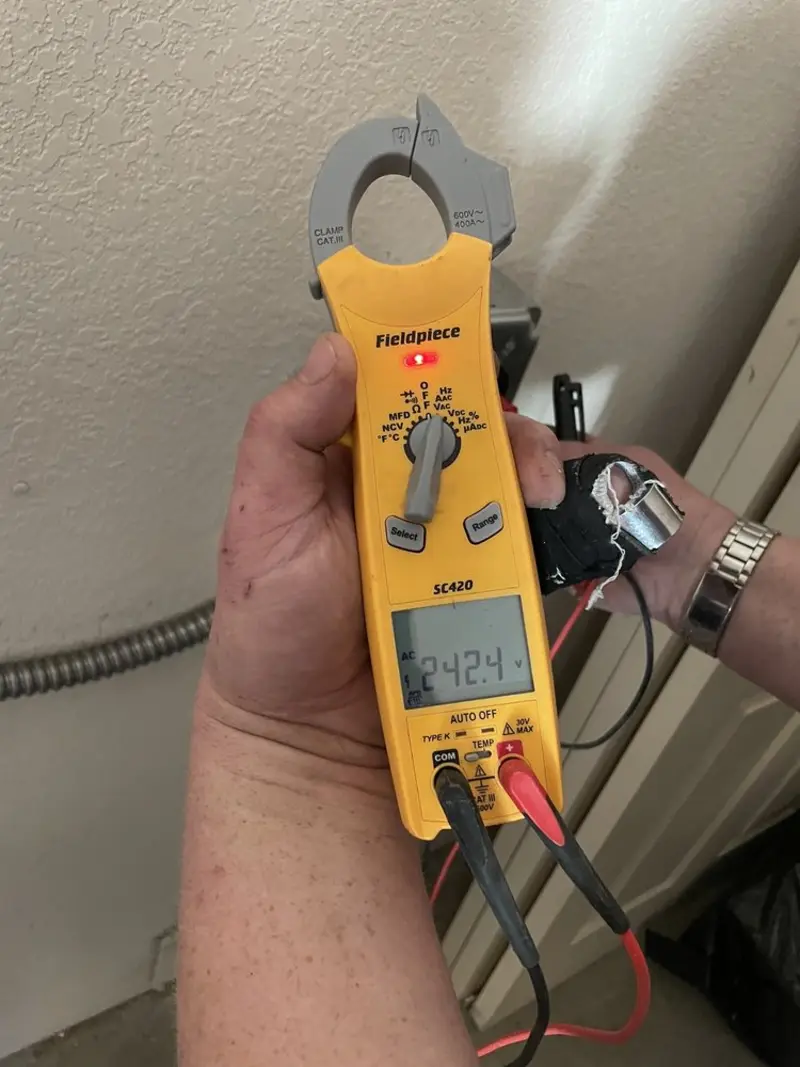Voltage testing with clamp meter during Electrical Installation Services in Collierville